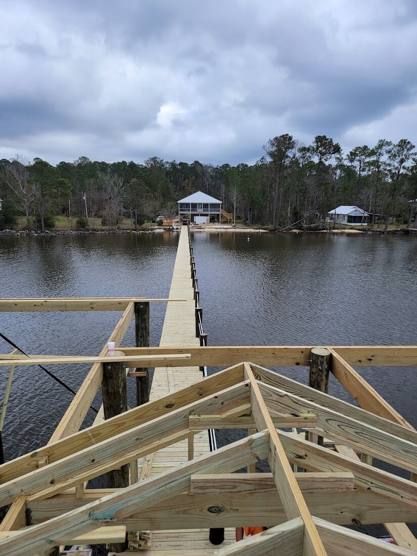 Waterfront roof structure framing in progress
