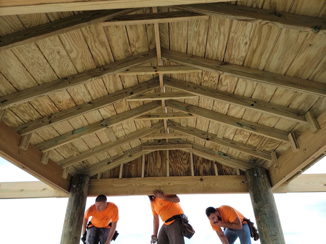 Covered dock with exposed timber roof framing