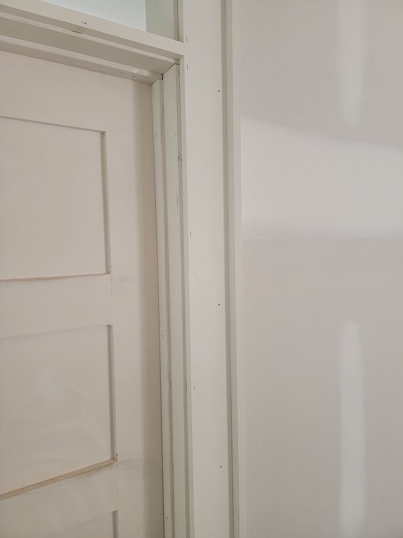 Interior paneled door and finish trim