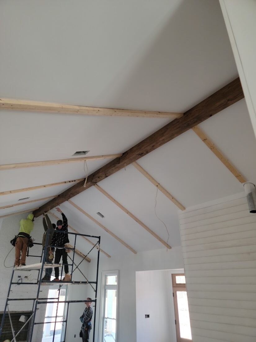 Open interior renovation with vaulted ceiling detail