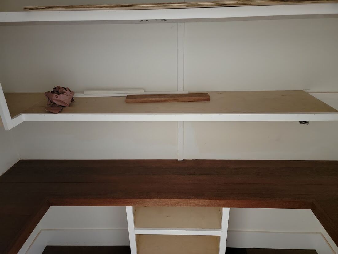 Built-in mudroom storage and hardwood bench