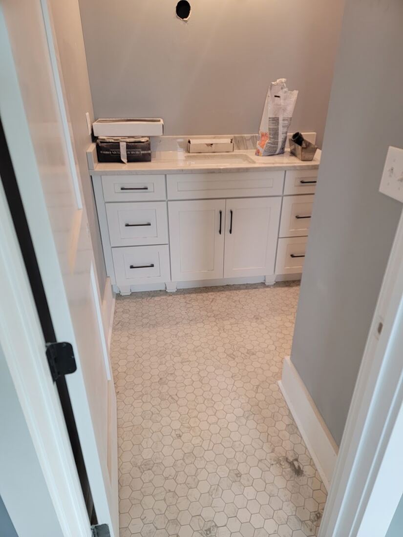 Finished bathroom cabinetry and tile work