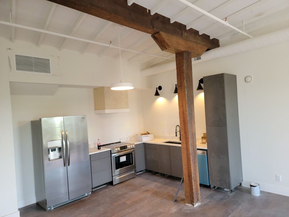 Kitchen renovation with exposed wood beams