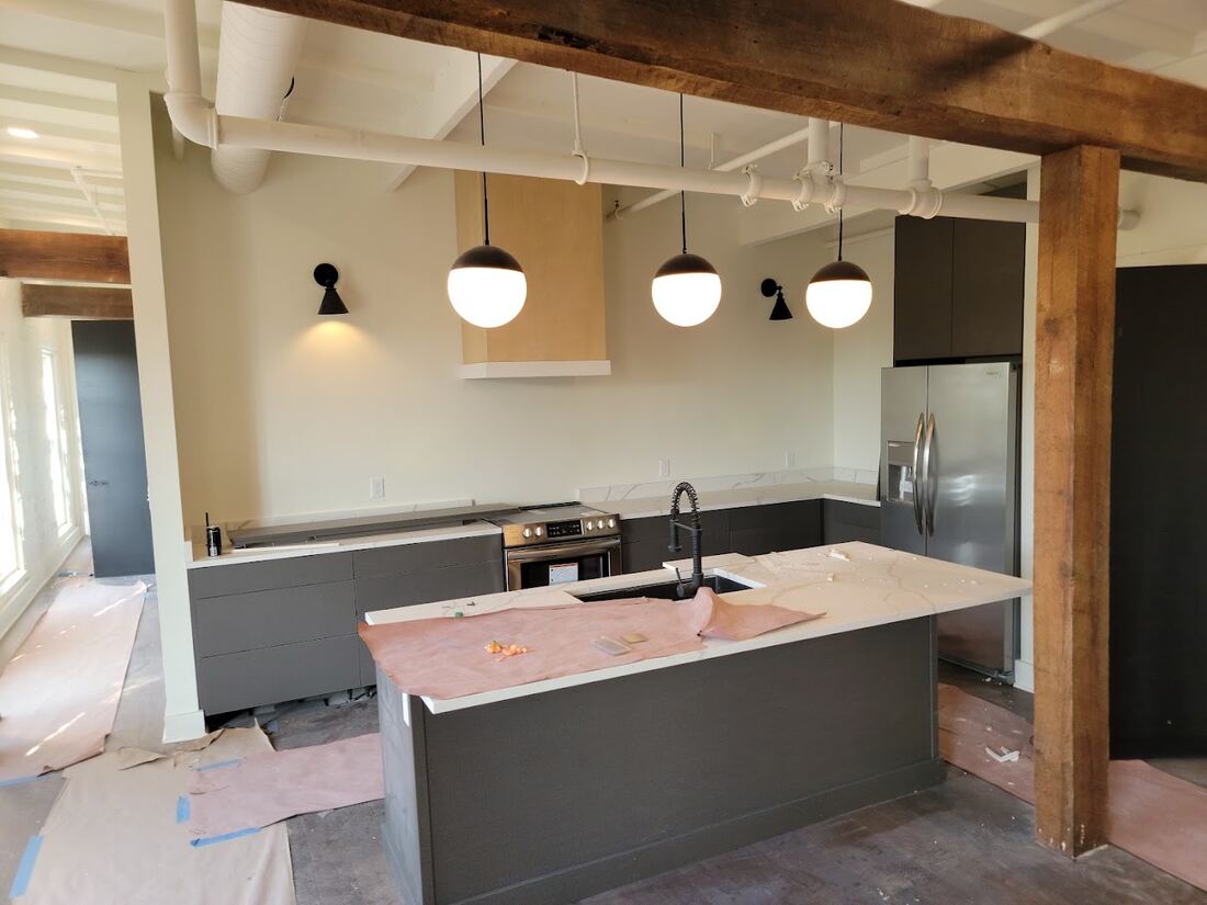 Open kitchen with finished timber posts and beams